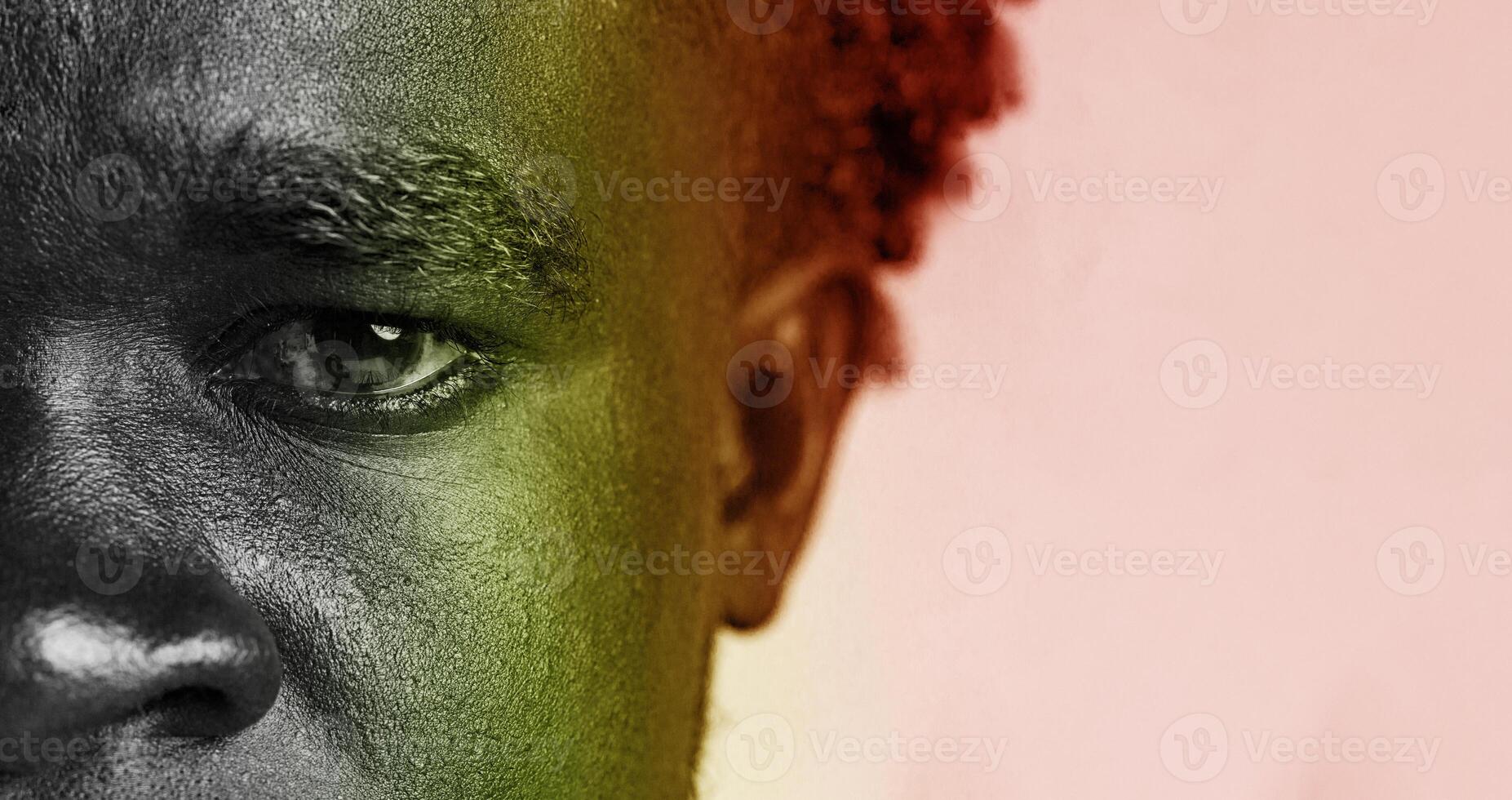 Portrait of a man with intense gaze showcasing emotions and depth in artistic black and white with color highlights photo