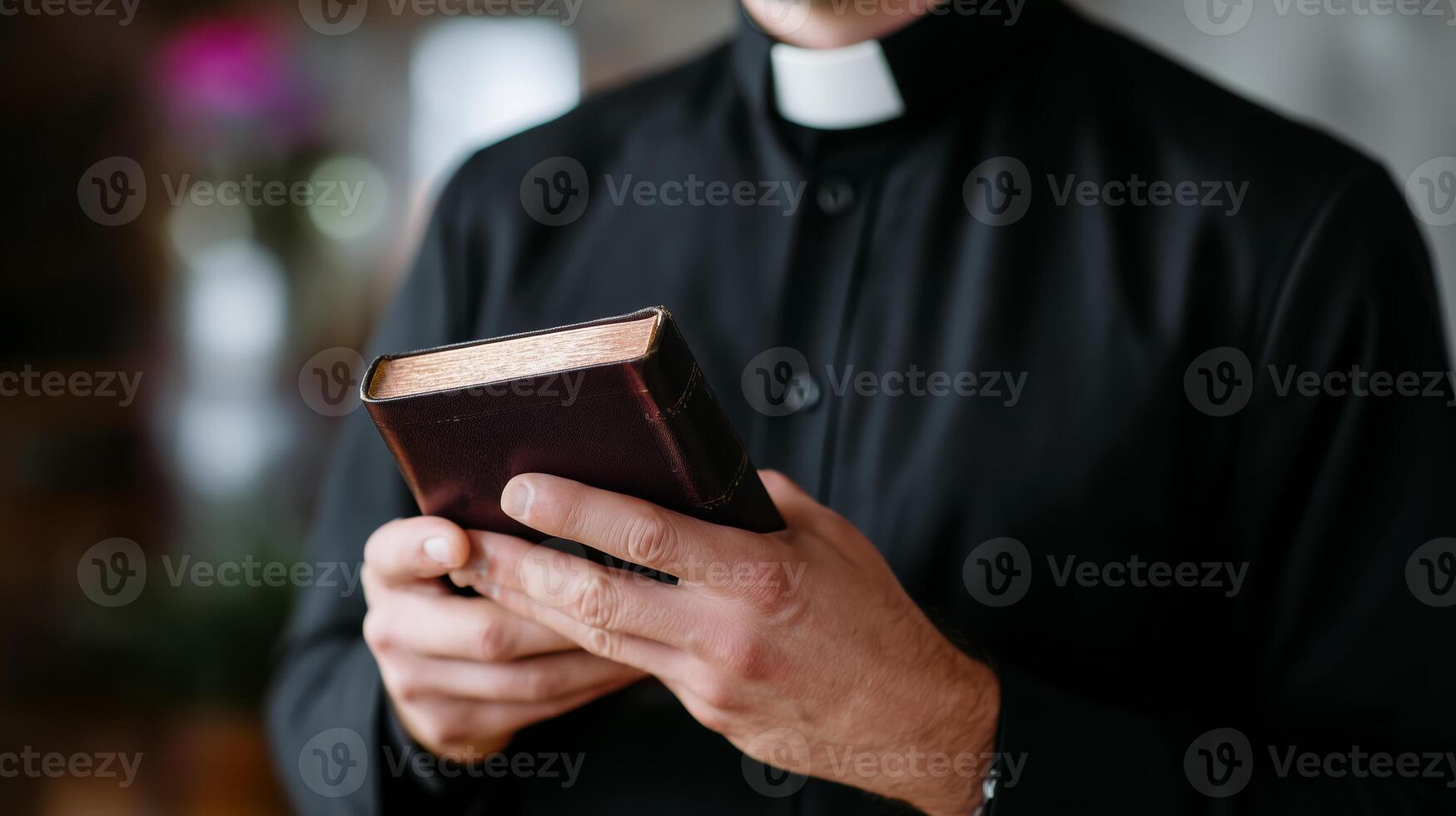 Clergy member holding an ancient book during a quiet moment of reflection in a serene environment photo