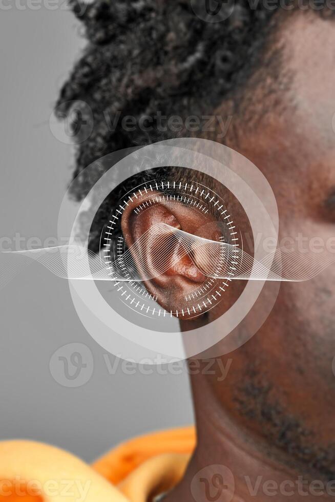 Exploring the intricacies of sound perception through a close-up of an ear with sound wave graphics photo