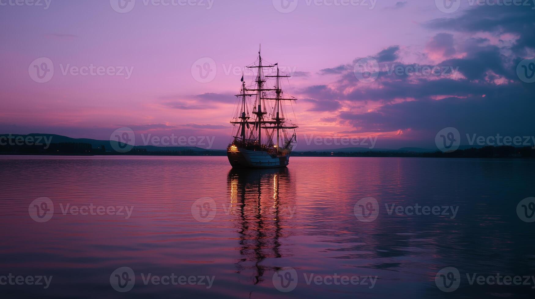 Majestic ship anchored in calm waters at sunset with vibrant colors reflecting on the surface photo
