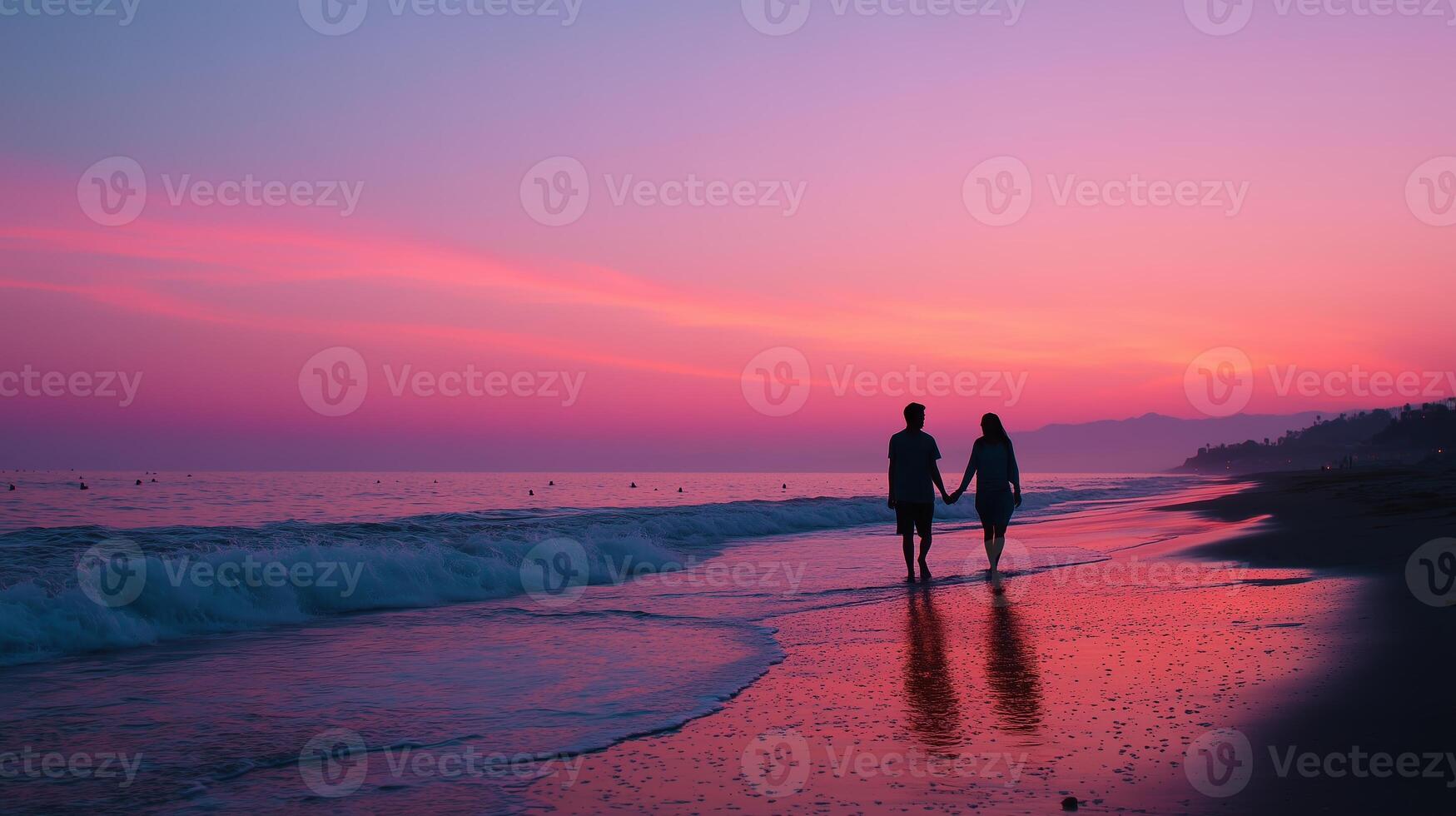 Romantic sunset walk on the beach with waves gently lapping at feet near coastal cliff photo