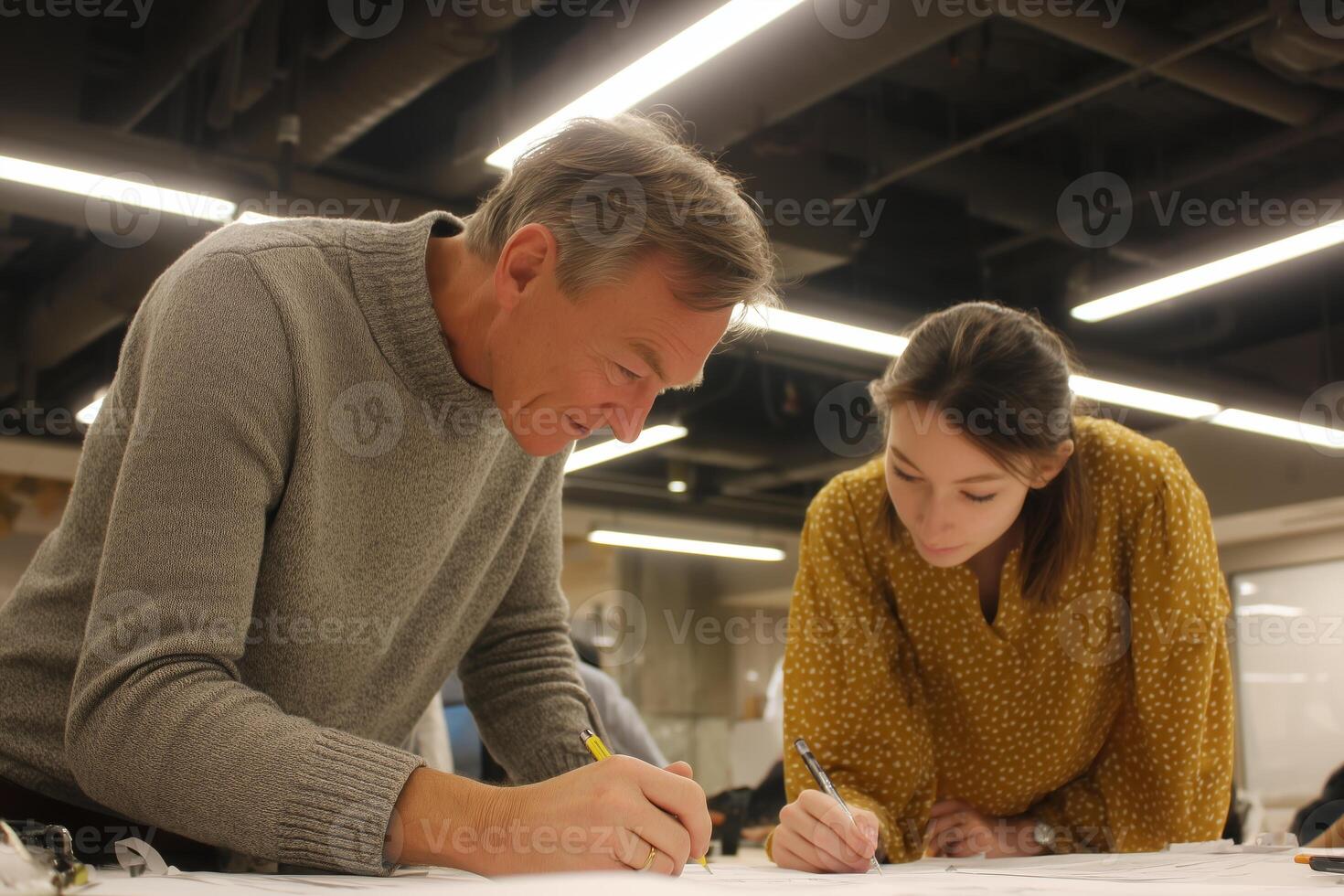 Collaborative design session with professionals working on project at a modern workspace in the evening photo