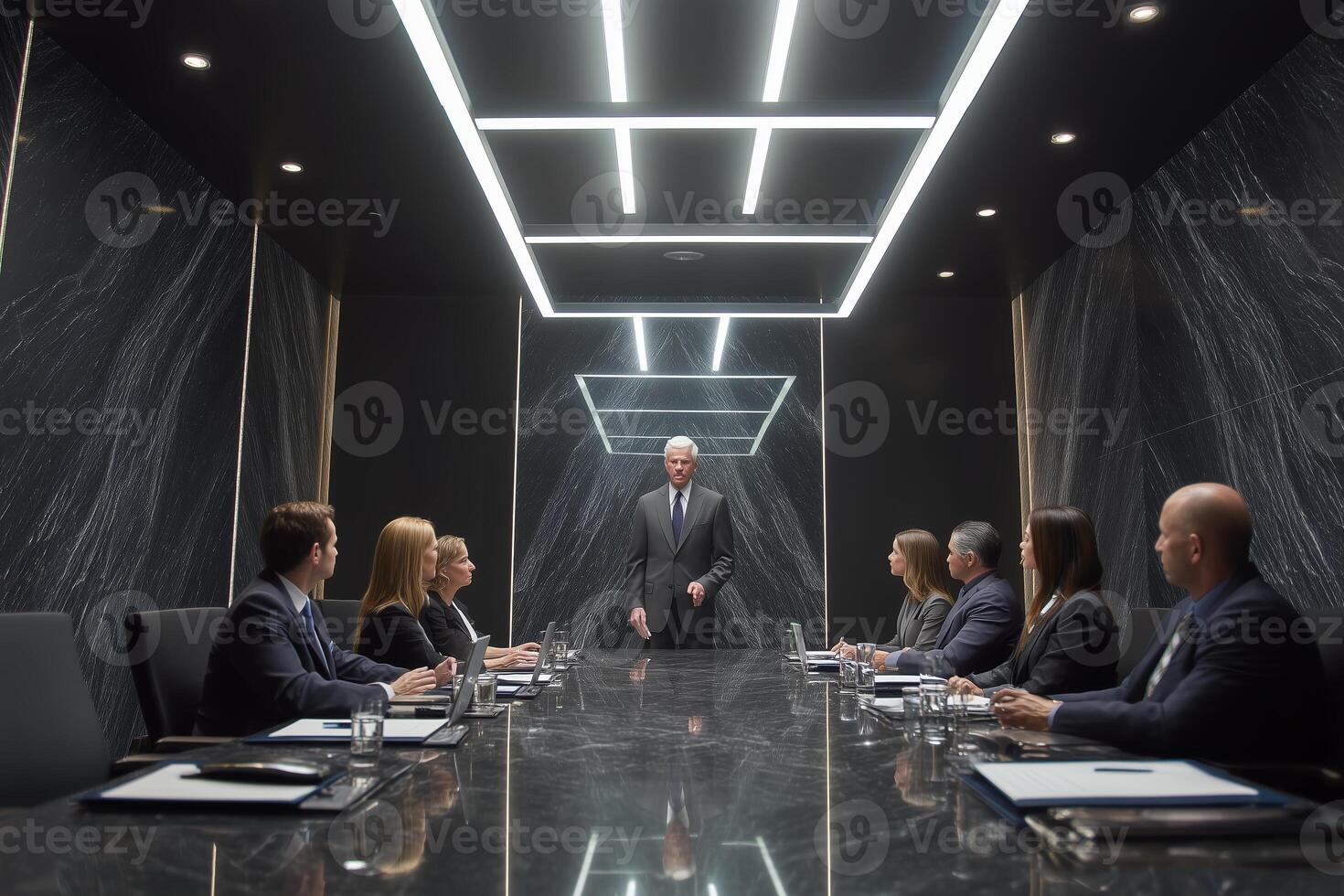 Business meeting with executives in a modern conference room discussing strategy in the evening photo