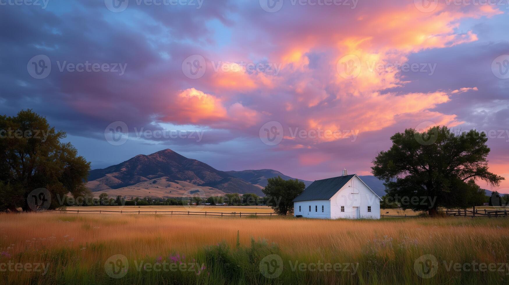 Sunset illuminates a serene white farmhouse against vibrant skies in a tranquil rural setting photo