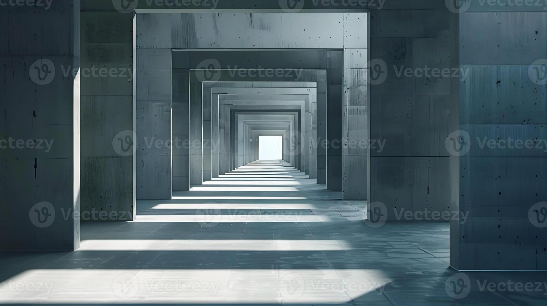 A long hallway with concrete pillars and light coming through photo