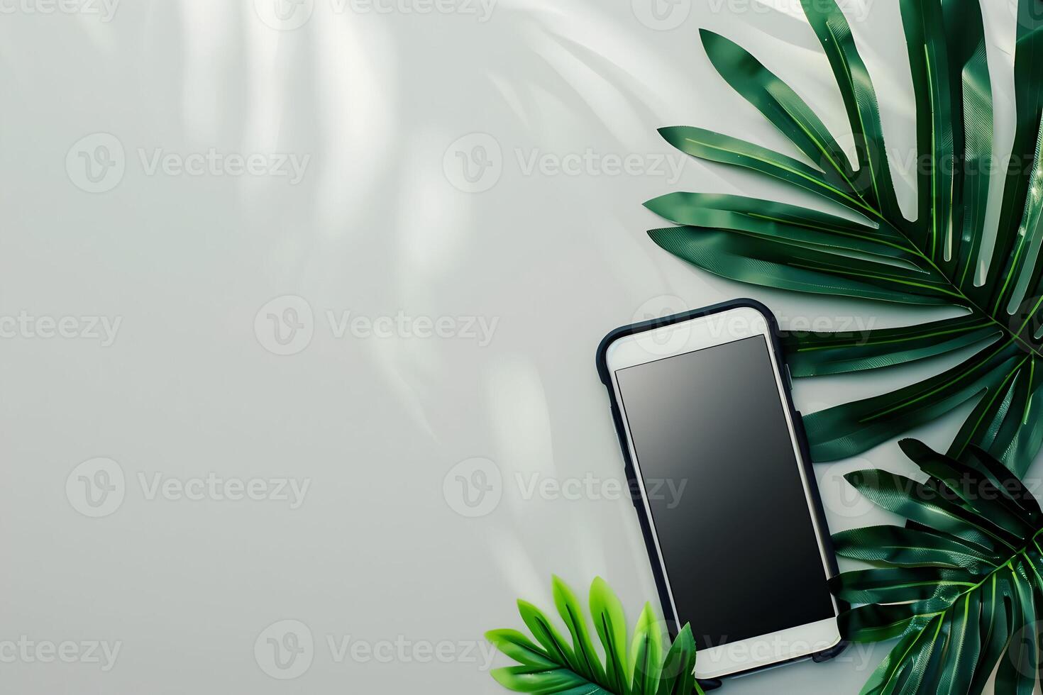 Top view of smartphone with palm leaves on white background photo