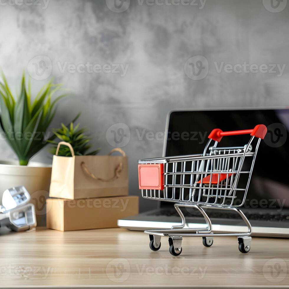 A shopping cart is sitting on a desk next to a laptop photo