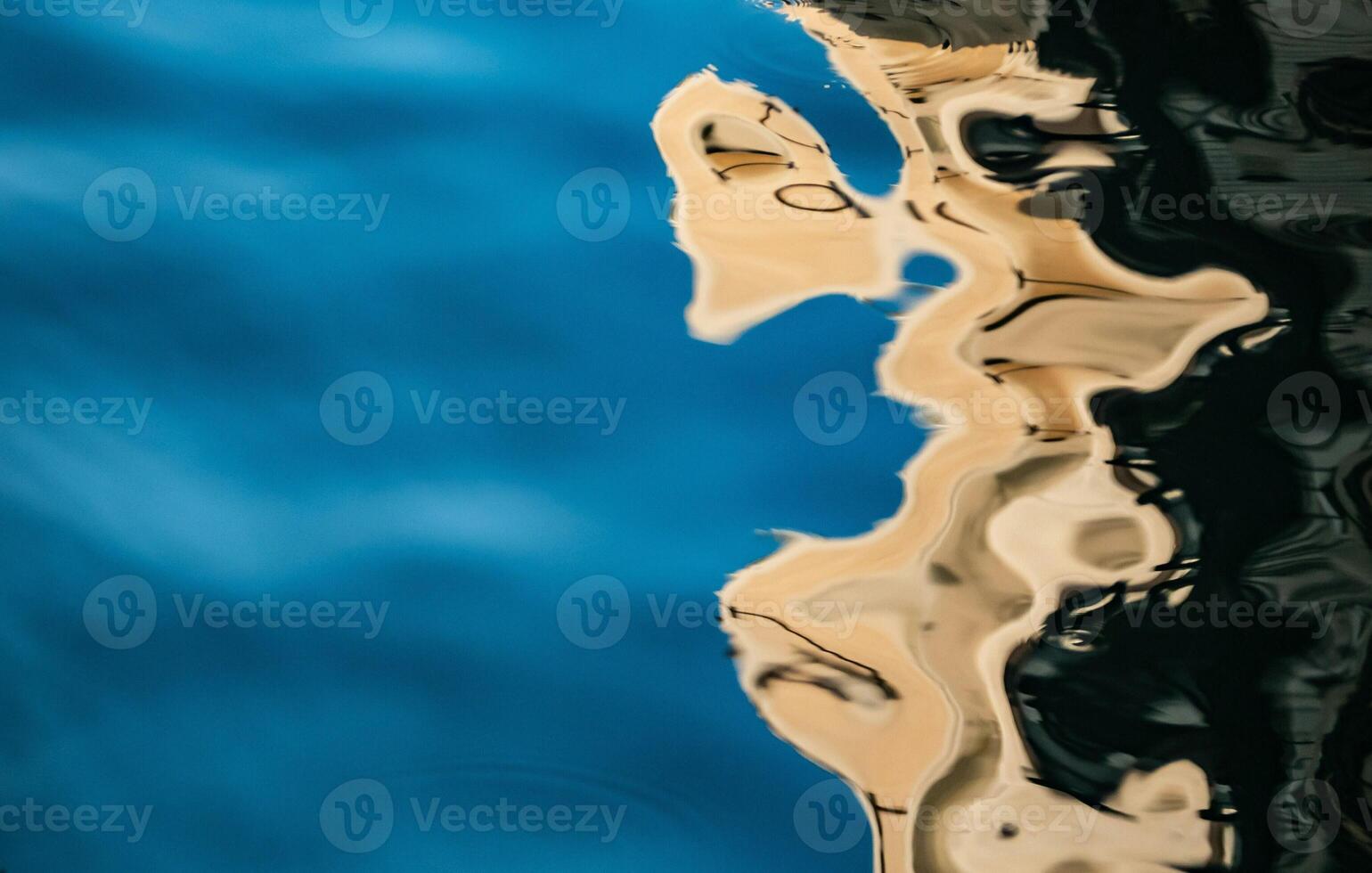 Serene water surface reflecting sky and city form photo