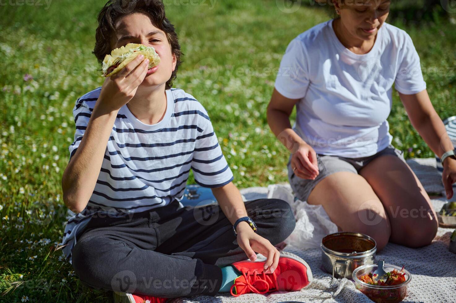 Mother and Child Enjoying a Summer Picnic in Nature photo
