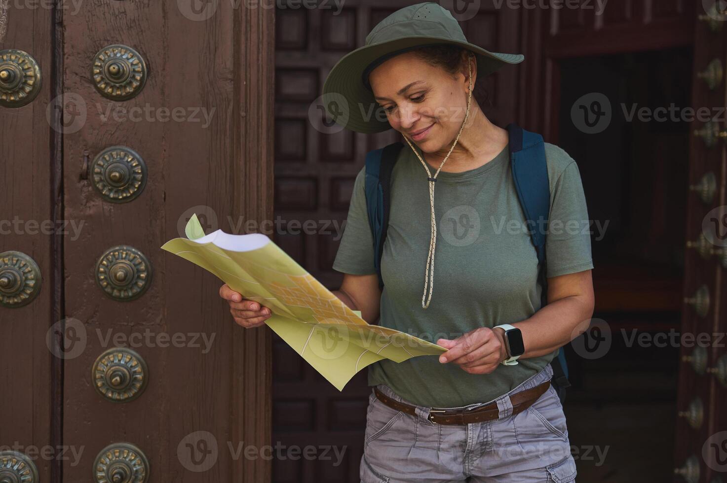 Traveler Exploring Historical Landmarks with a Map in a Historic City Setting photo