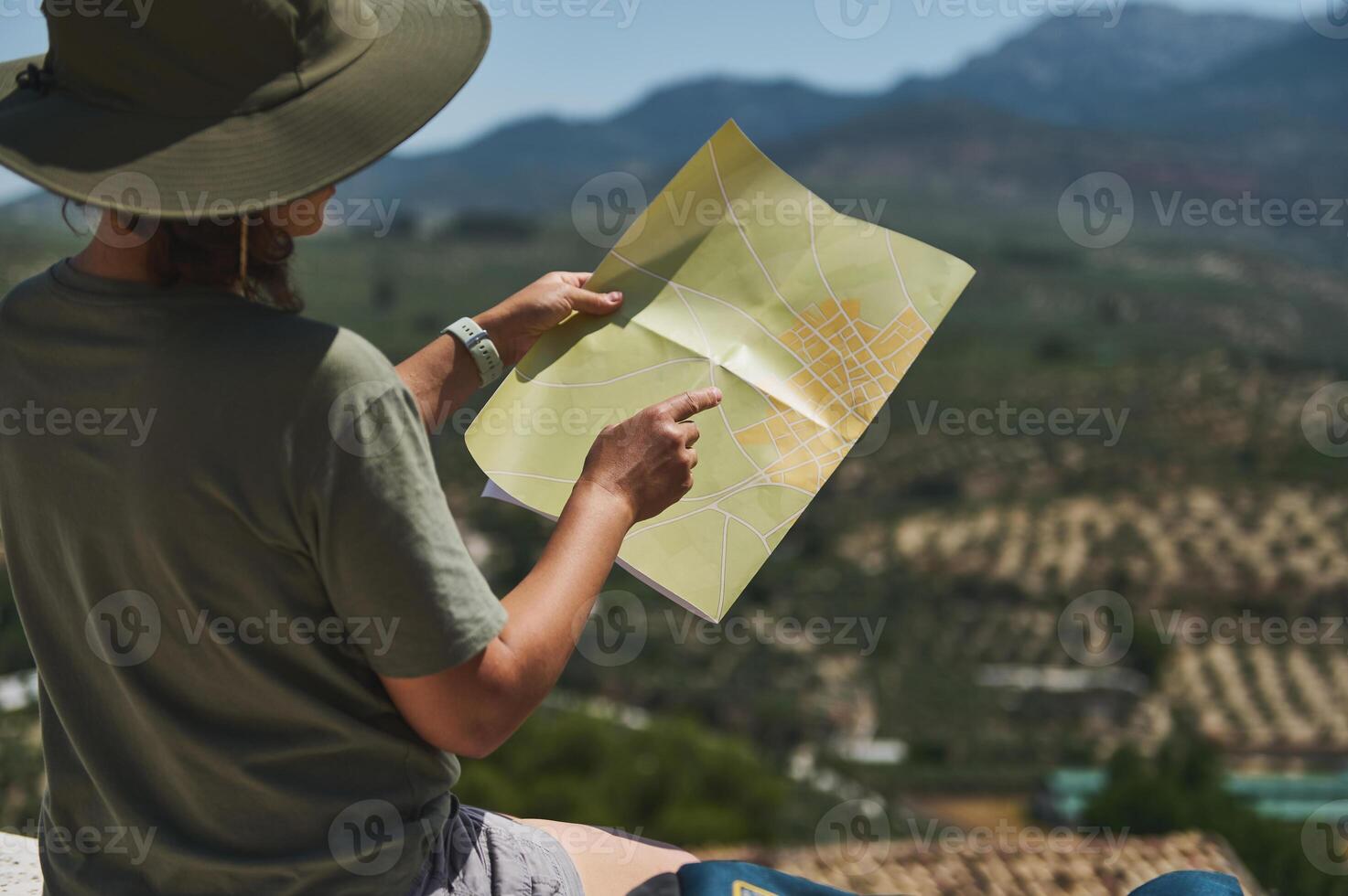 Traveler Exploring Medieval Village with Scenic Mountain Views photo