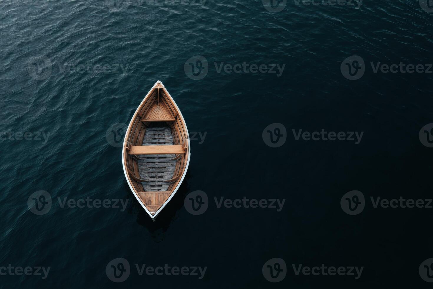 Lonely wooden boat floating on dark waters at twilight photo