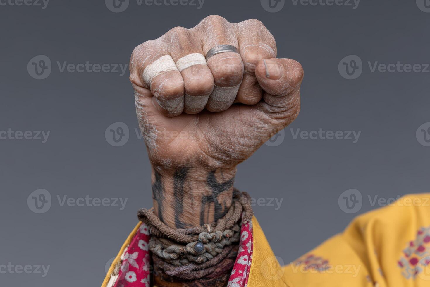 Strong hand gesture representing resilience and determination with detailed adornments photo