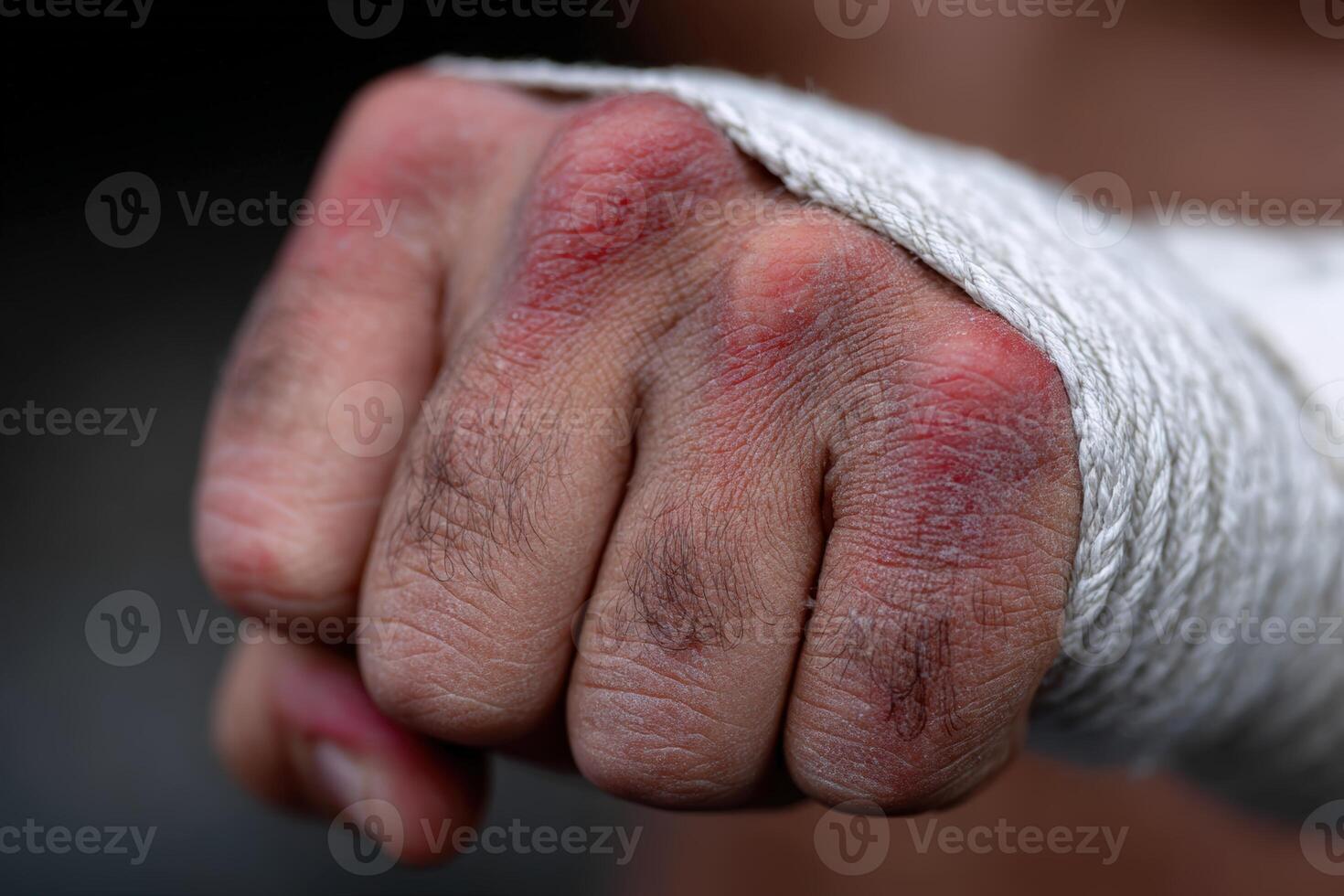 Fist wrapped in tape shows signs of intense training and hard work at the gym photo