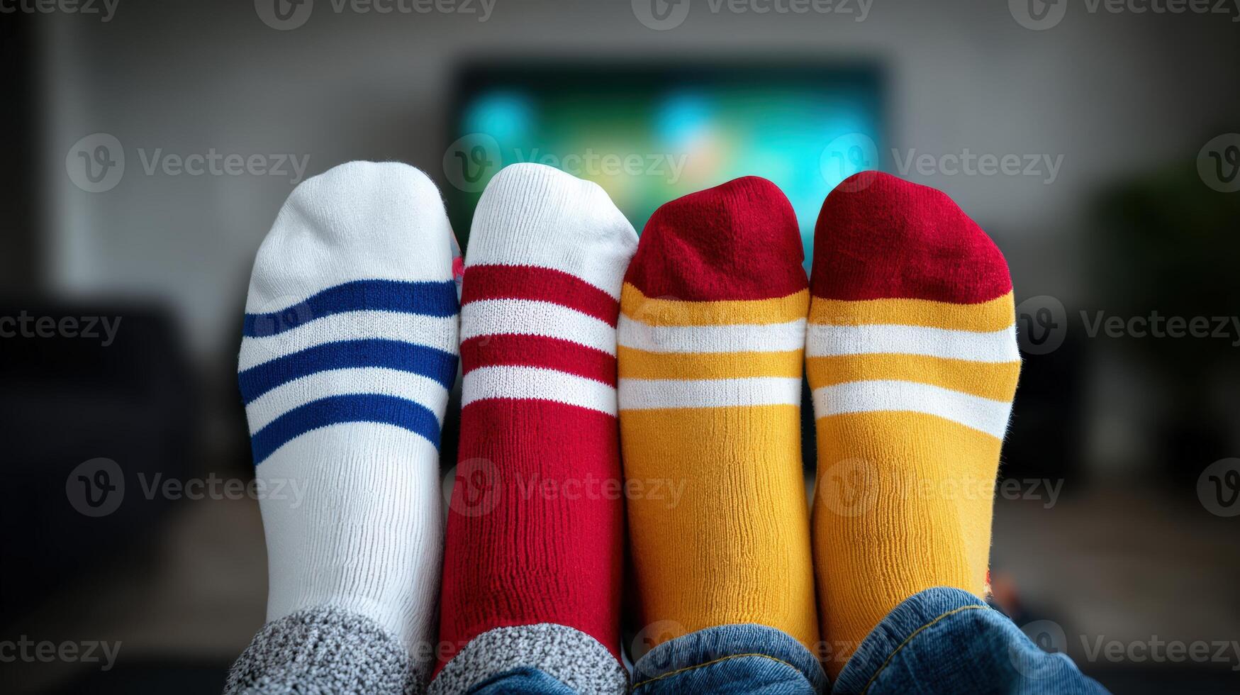 Colorful socks displayed in front of a television during a cozy home gathering photo
