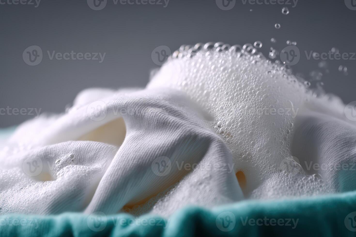 Sudsy laundry being washed during a bright afternoon at home photo