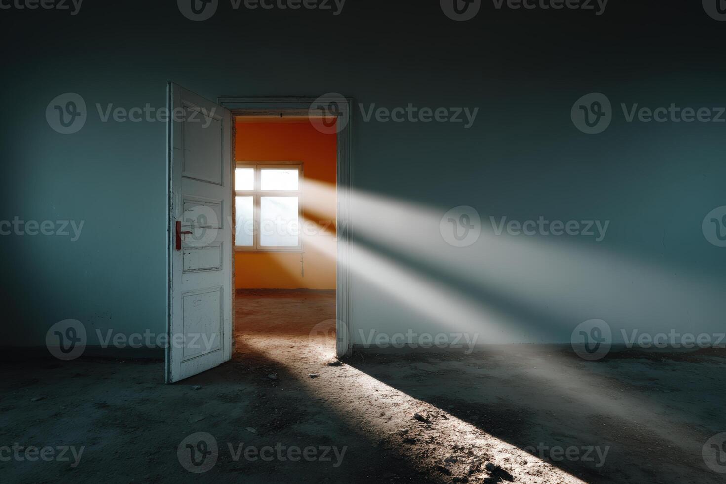 Light streams through an open door illuminating an empty room at dawn in a deserted space photo