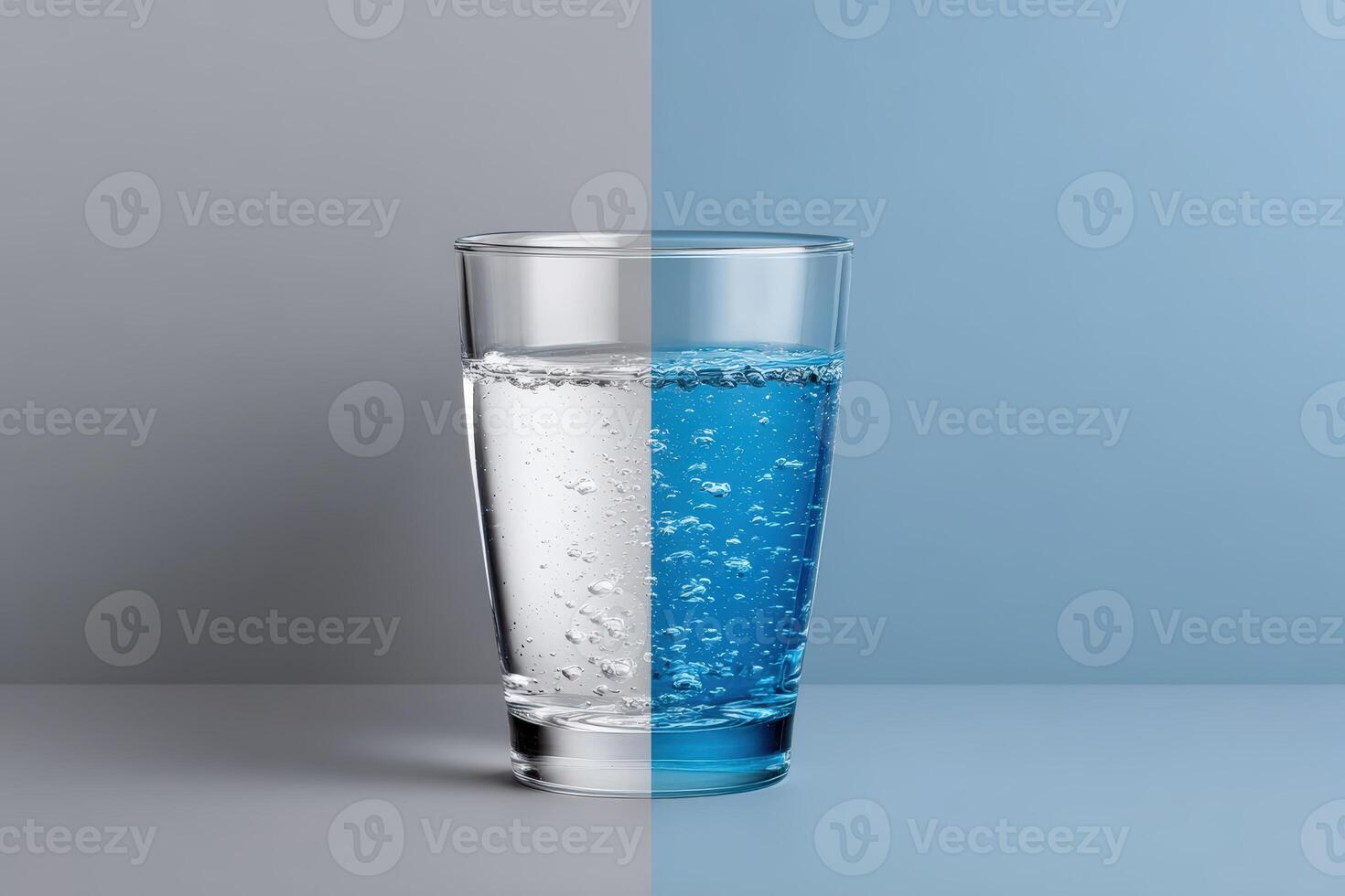 Contrast of clear and tinted water captured in a glass on a split background photo