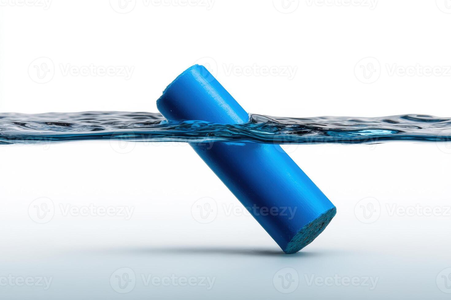 Blue chalk partially submerged in clear water creating a unique visual effect photo
