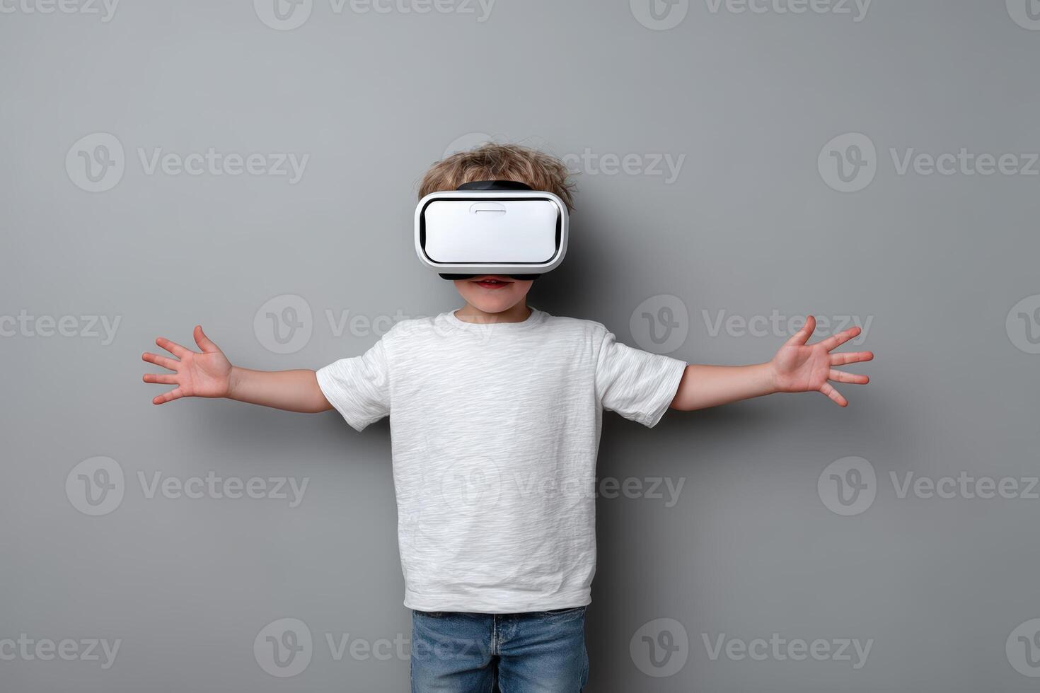 Child explores virtual reality in a gray room with arms outstretched during an immersive experience photo