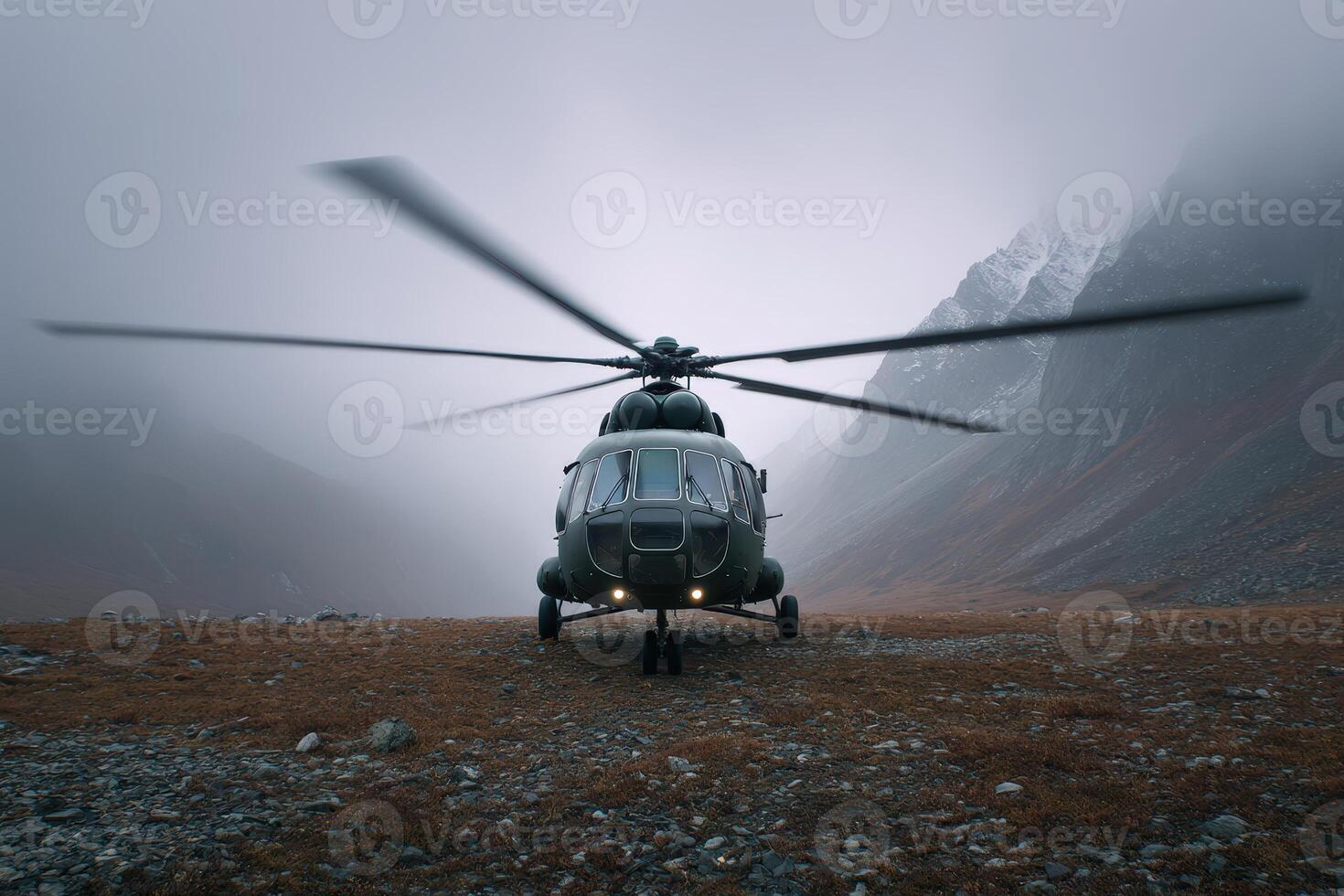 Helicopter blades spin in misty mountain landscape during overcast conditions photo