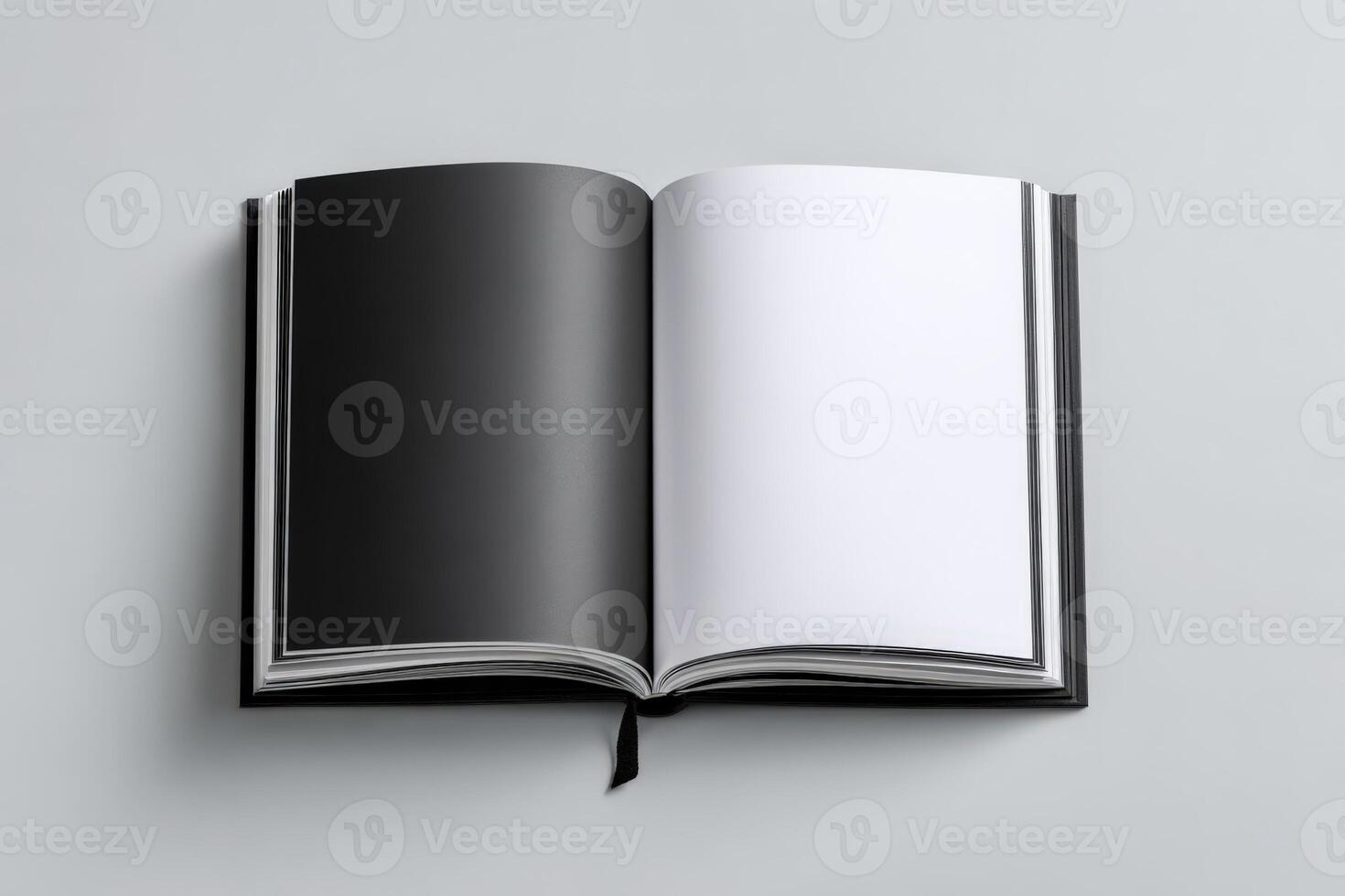 Open book with blank black pages resting on a neutral backdrop during daylight hours photo