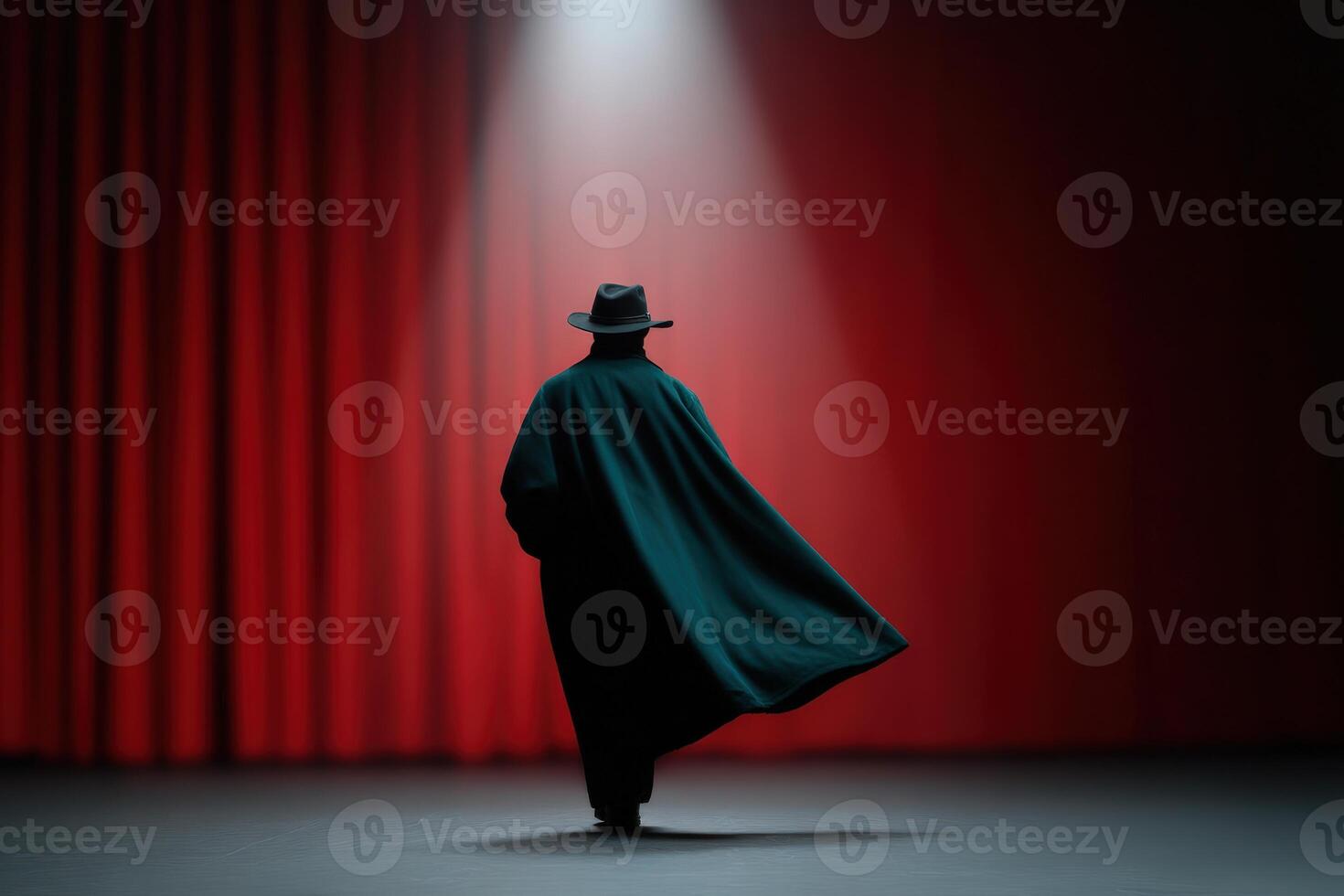 Actor performs dramatically in an old theater under a spotlight with red curtains photo