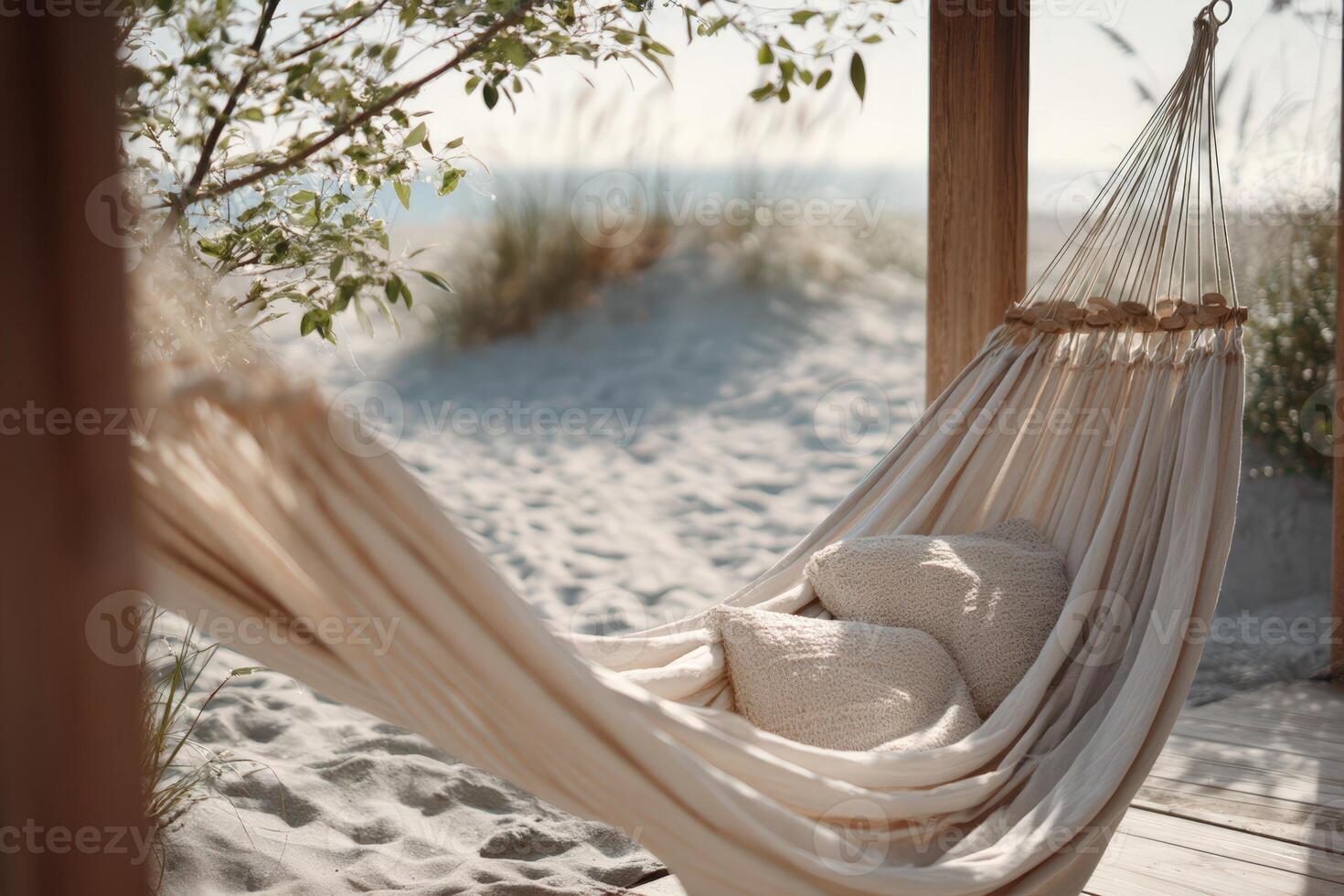 Chic beige hammock with cushions set against a serene beach background in sunlight photo