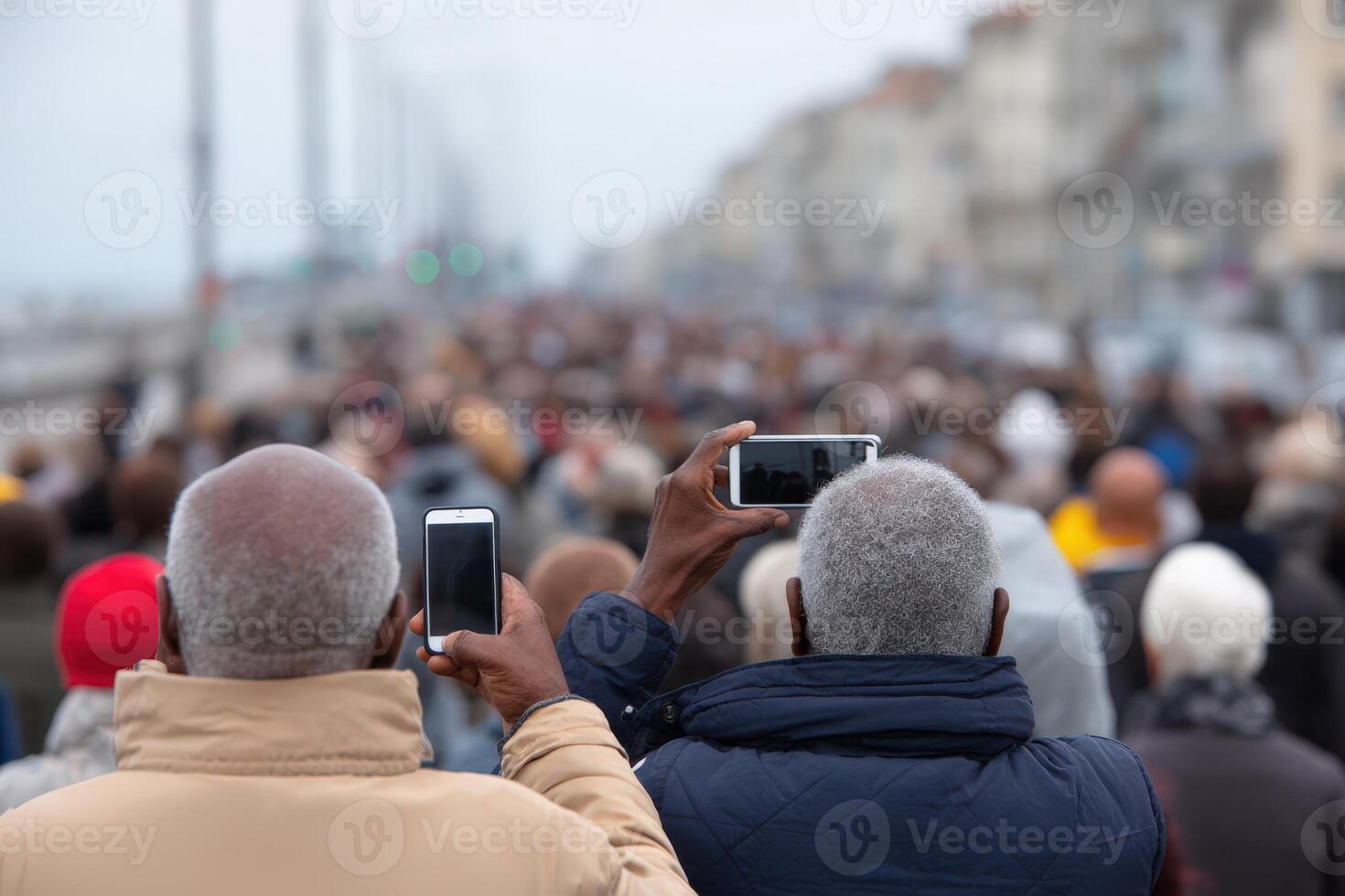 Crowd of urban people using mobile phones at a busy outdoor event in a coastal city setting photo