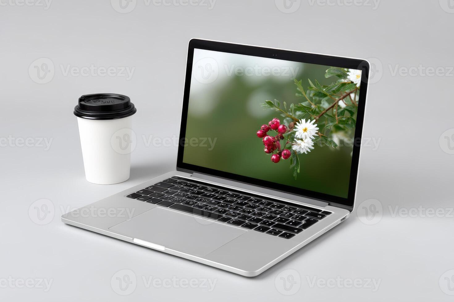Laptop with AI interface displayed on a white table next to a coffee cup photo