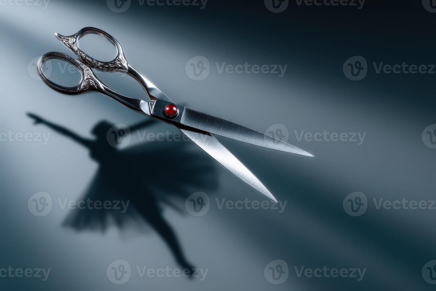 Scissors cast a shadow resembling a dancing human figure in soft light photo
