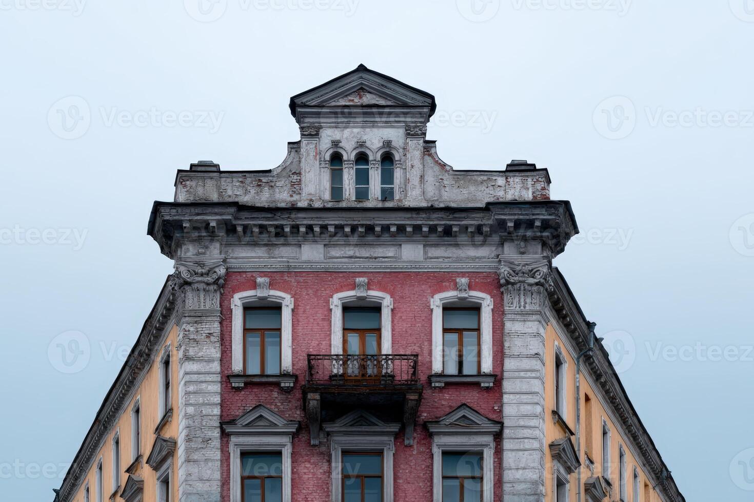 Building design reminiscent of a faded yearbook cover located in a historic urban setting photo