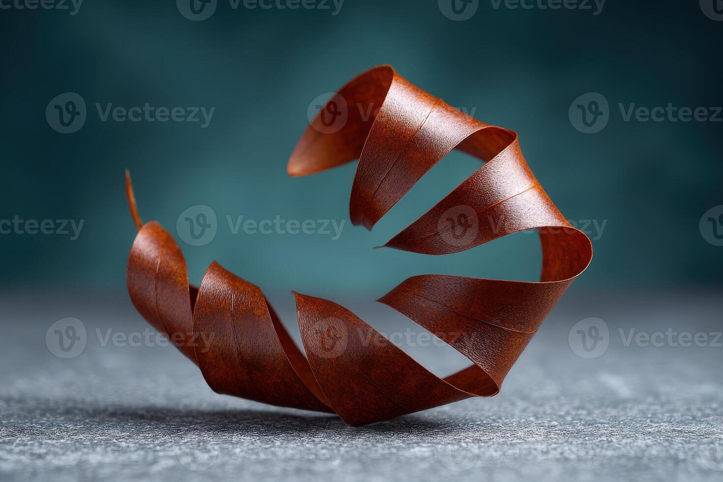 Coiled copper wire curls gracefully against a textured background photo