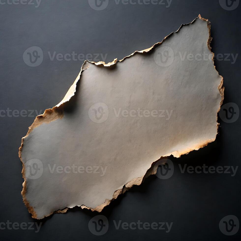 Abstract Torn Paper with Rough Edges on Dark Background Texture photo