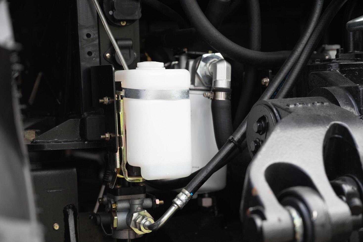 Close-up of a complex automotive engine system with white filters. photo