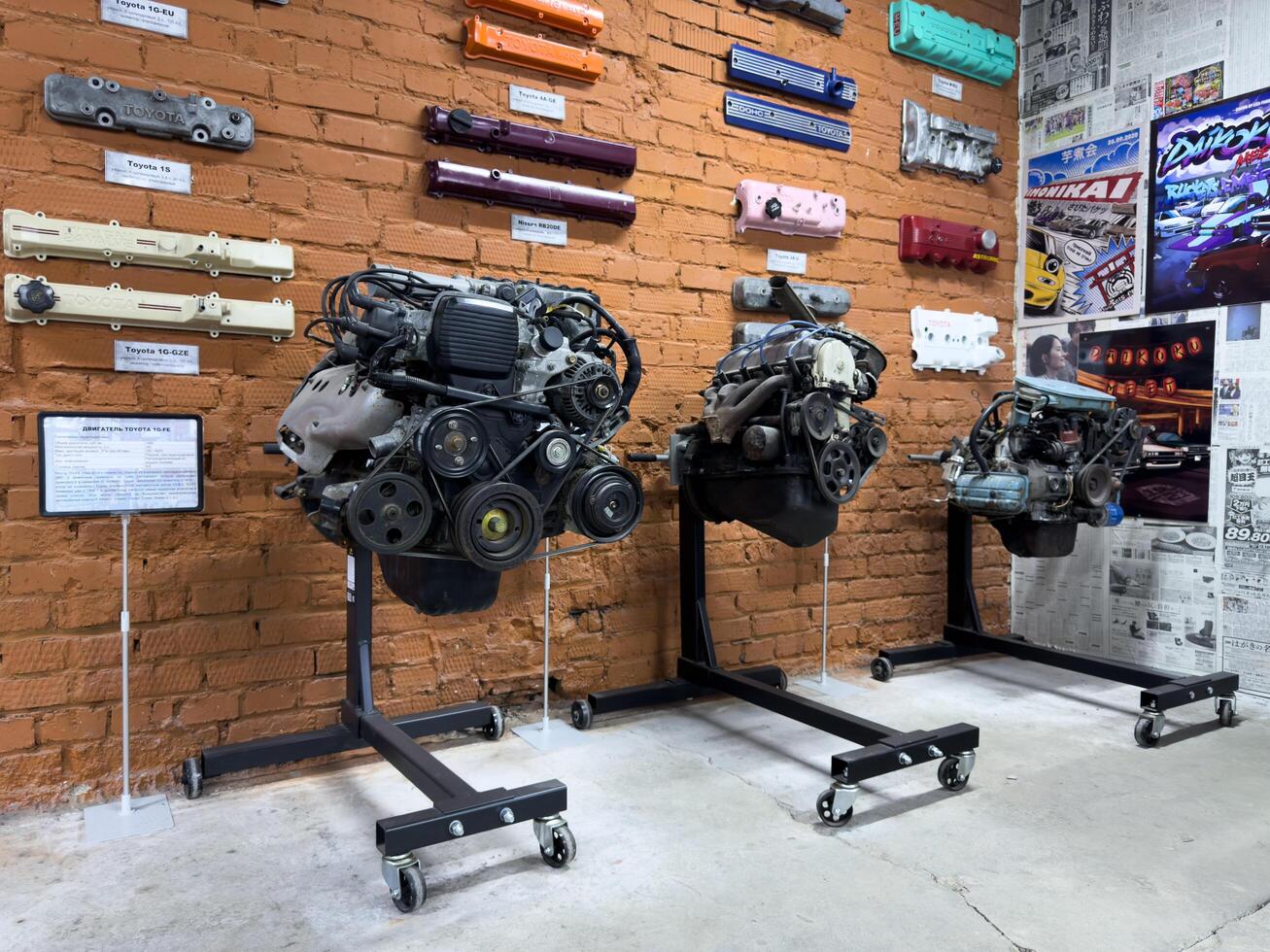 Moscow, Russia, April 27, 2025 Display of iconic Japanese engines including the Toyota 4A-GE, surrounded by colorful valve covers and tuning history at dedicated exhibition space in Japanese museum photo