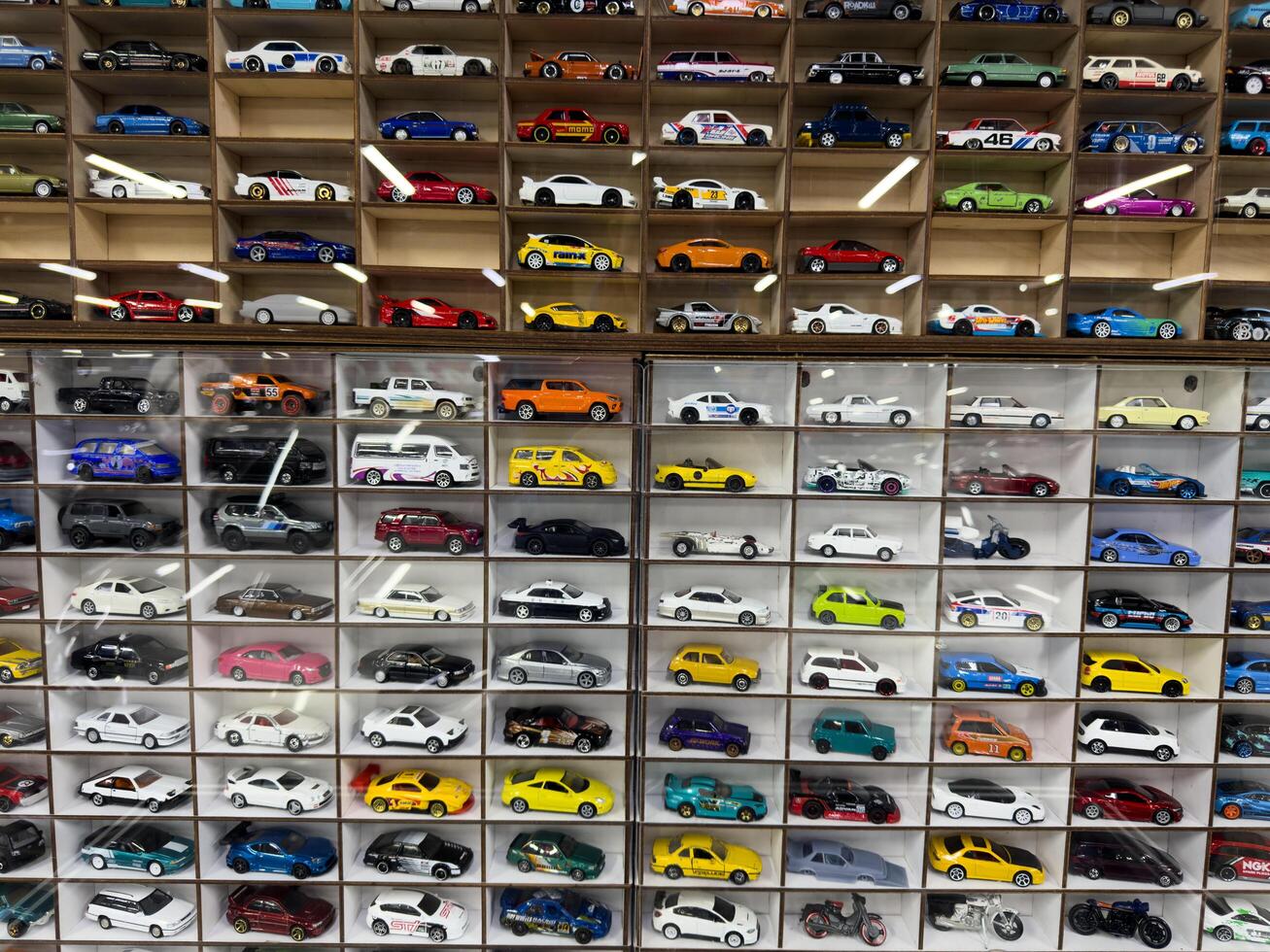 Moscow, Russia, April 27, 2025 Brightly arranged collection of toy cars displayed in neat compartments, celebrating the diversity of vehicle design in miniature form photo