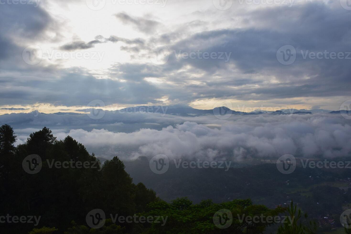 A view of the mountains and clouds from a hilltop photo