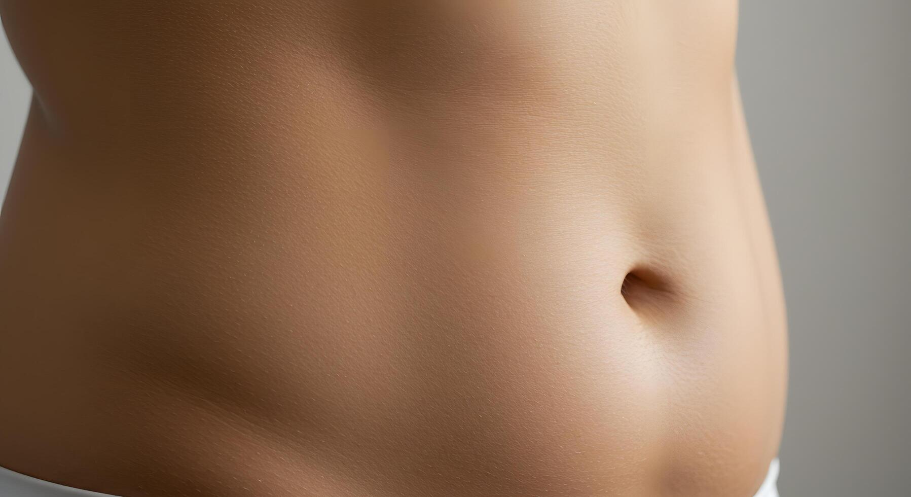Artistic detail of a female belly with smooth texture, ideal for body positive campaigns, holistic wellness branding, or dermatology visuals. photo