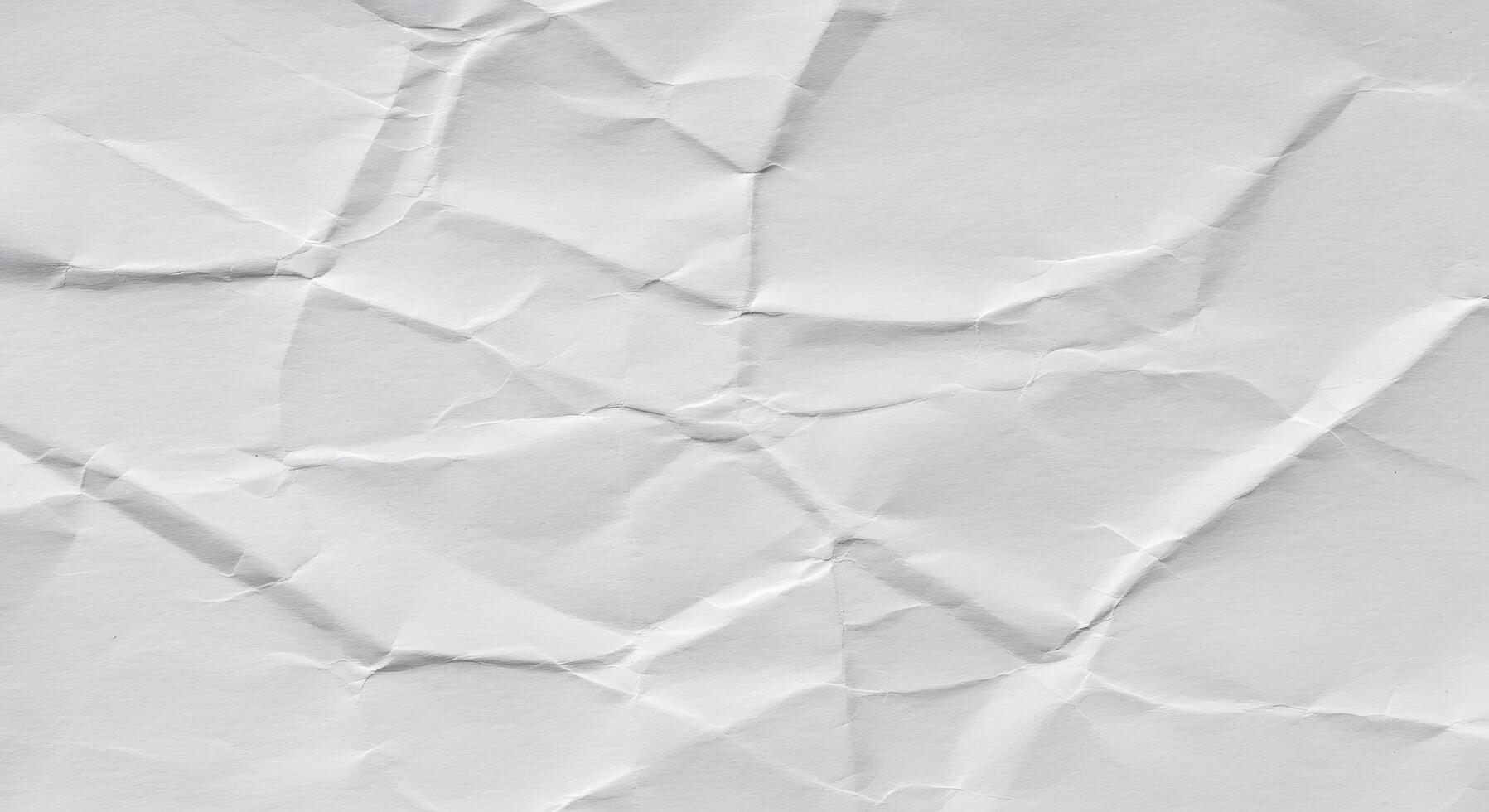 Crumpled white paper texture as a background image, perfect for minimalistic designs, note-style content, or stationary mockups. photo