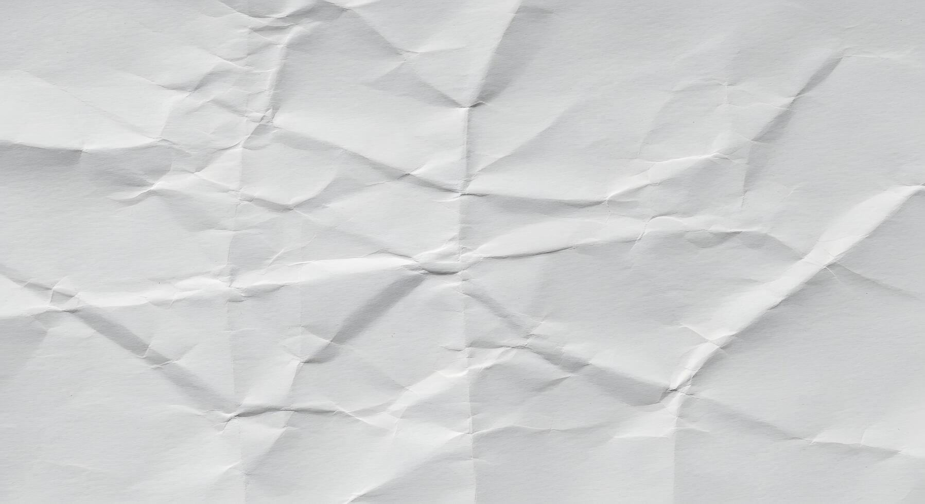 Crumpled white paper texture as a background image, ideal for presentation backgrounds, website banners, or creative typography posters with copy space. photo