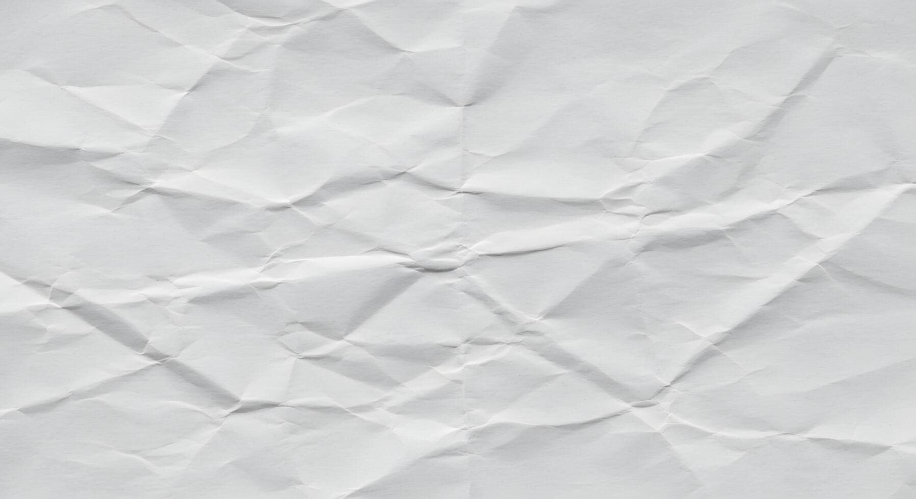 Crumpled white paper texture as a background image, designed for modern branding, printable templates, or editorial layouts needing subtle texture. photo