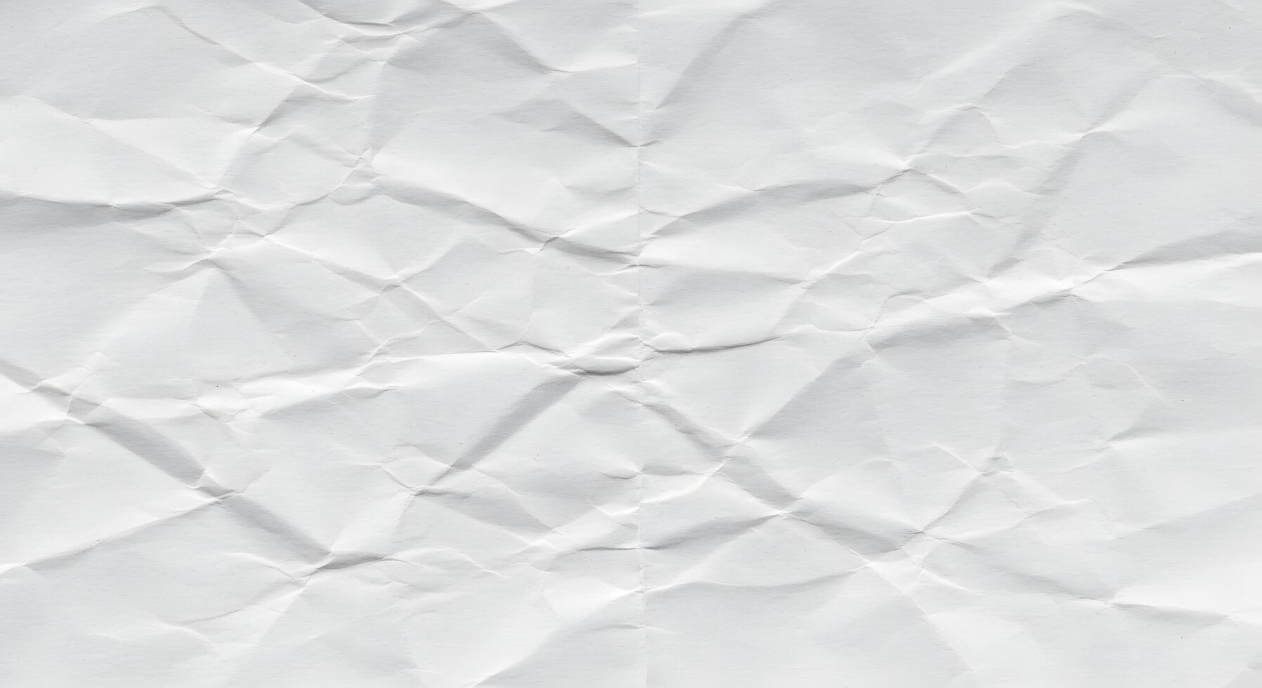Crumpled white paper texture as a background image, great for blog headers, digital scrapbooks, or school-themed design projects. photo
