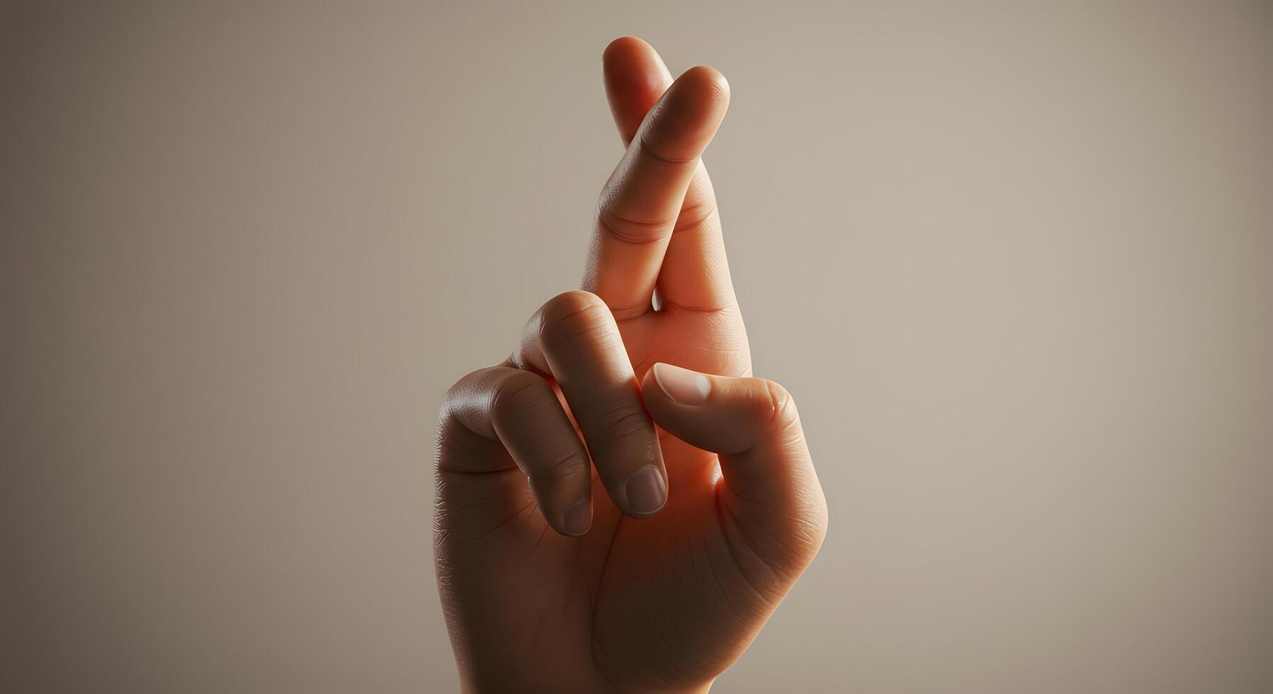 Fingers crossed, neatly framed on a neutral background, symbolizing optimism and hope photo