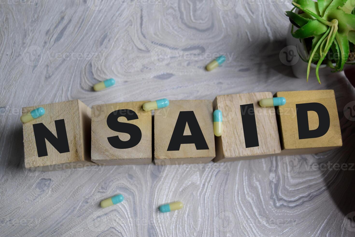 Concept of NSAID Symbol. Wooden block with words NSAID photo