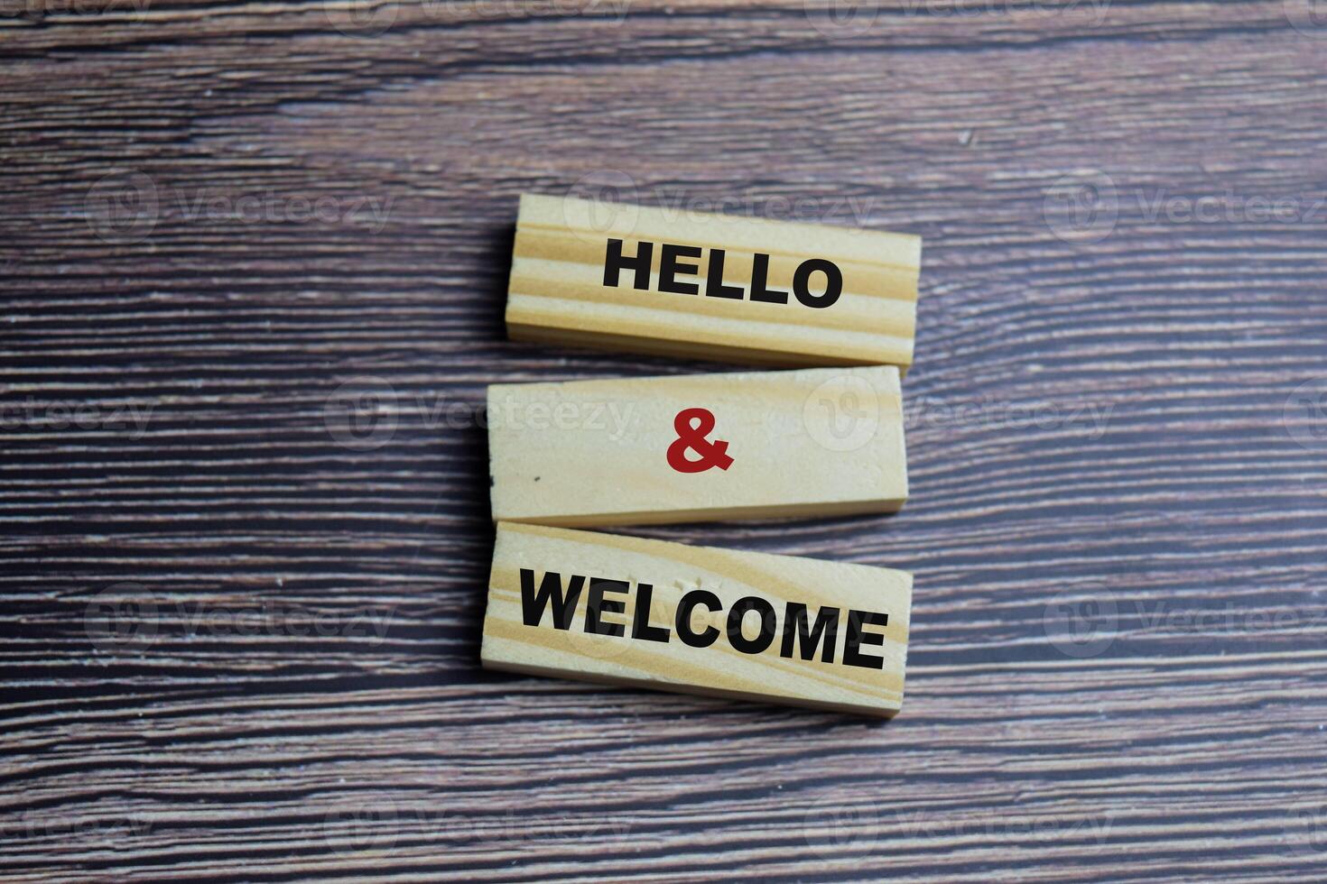 Concept of Hello and welcome Symbol. Wooden block with words Hello and welcome photo