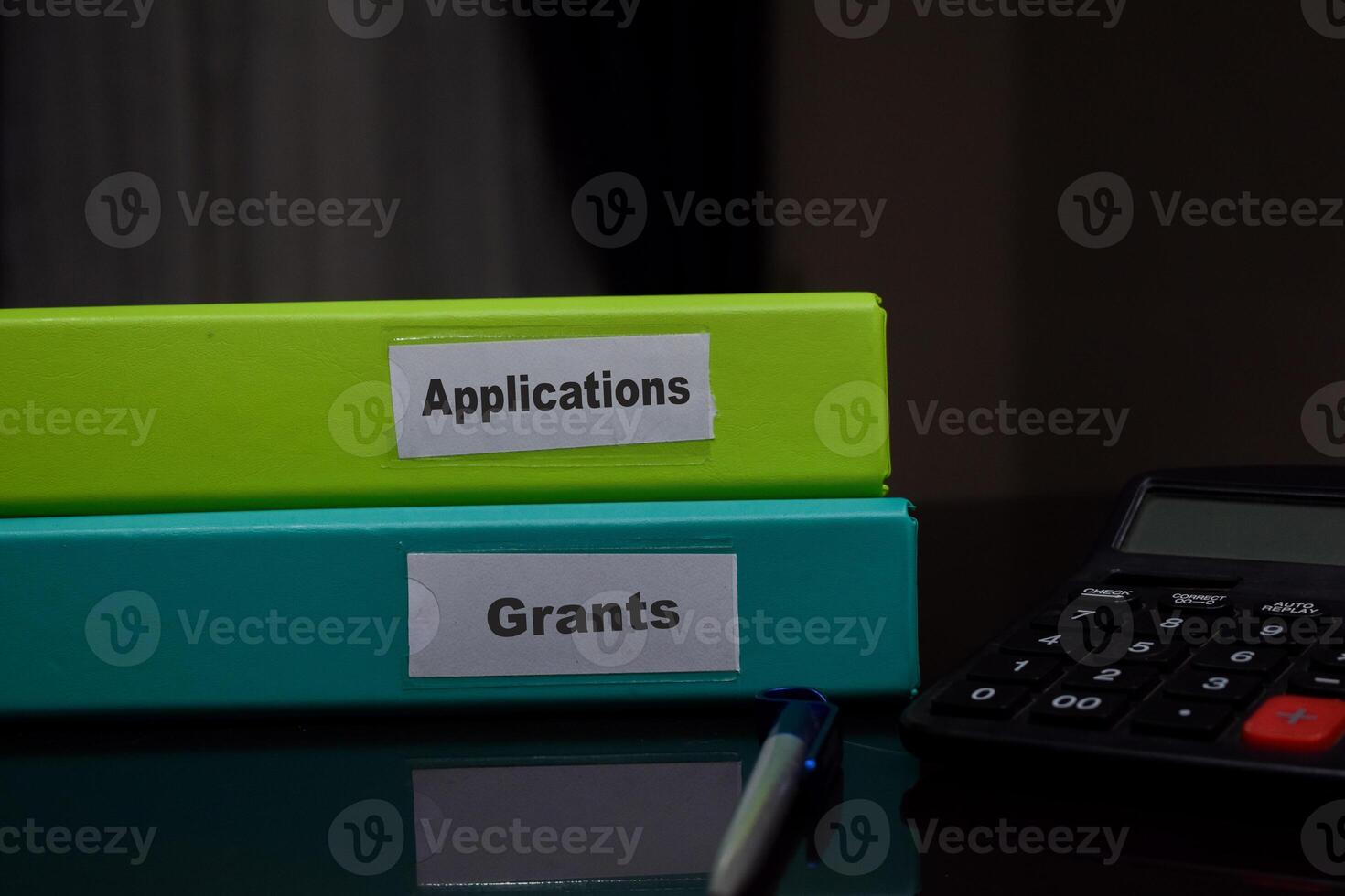 folders with the label Applications and grants. Business management concept photo