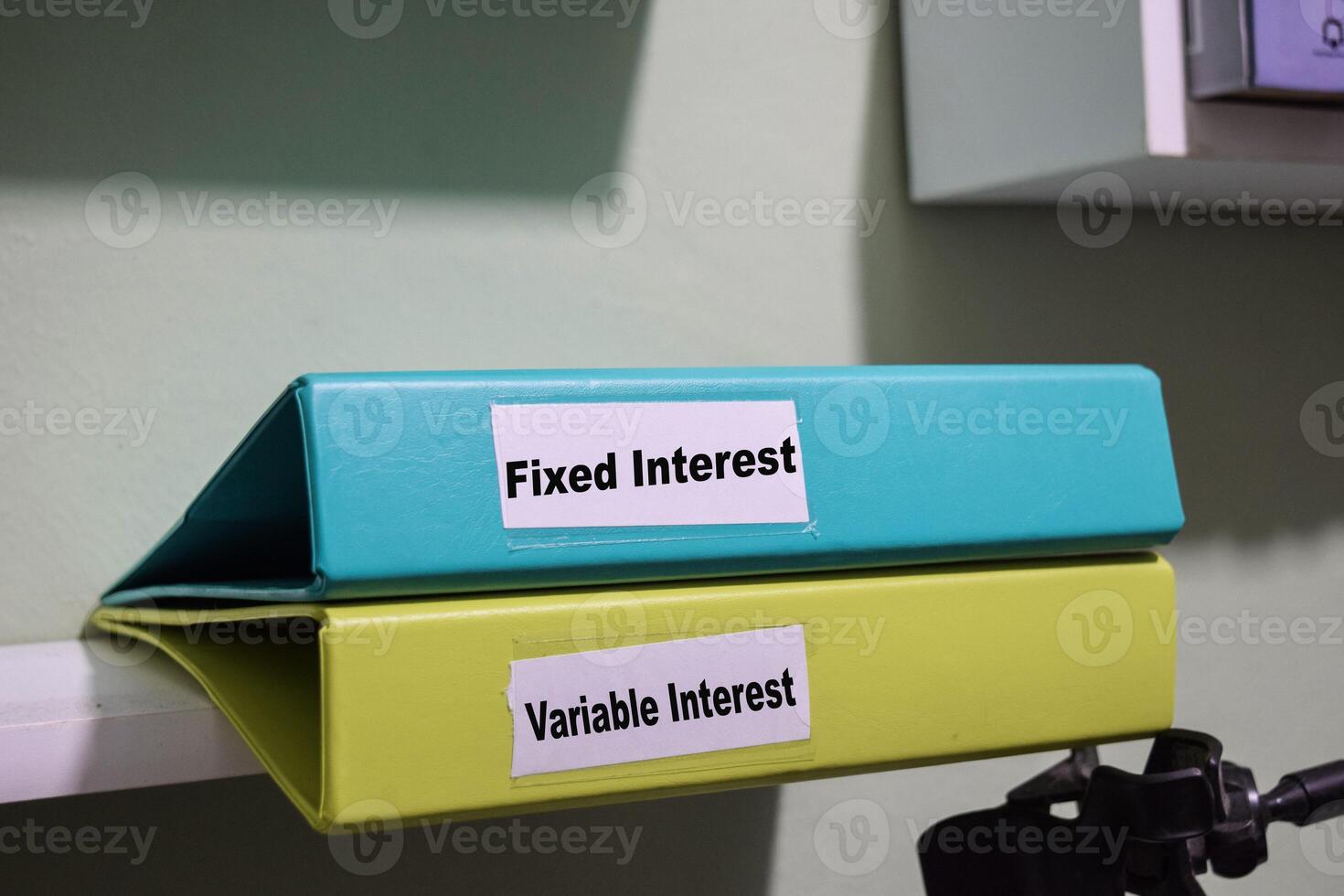 folders labeled fixed and variable interest, loan management concept photo