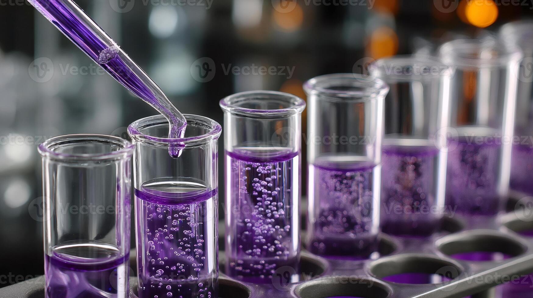 Scientist dripping purple chemical liquid into test tubes in laboratory photo