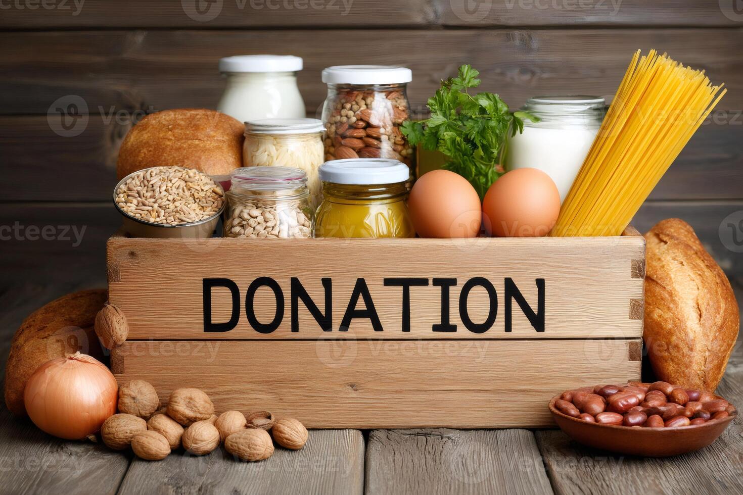 Donation box full of different products on wooden background photo